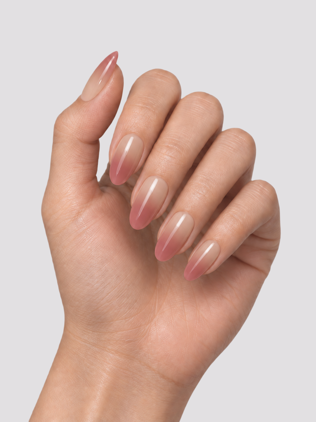 Nude Illusion medium oval press-on nails – worn on hands