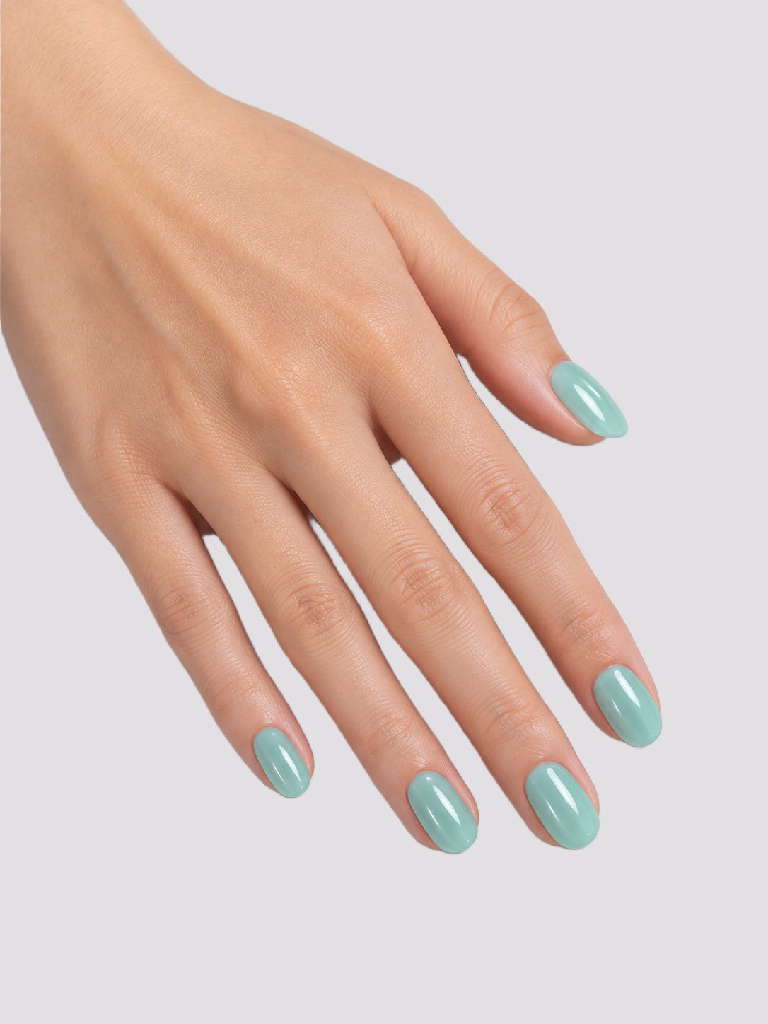 Mint Mirage short oval press-on nails – worn on hands