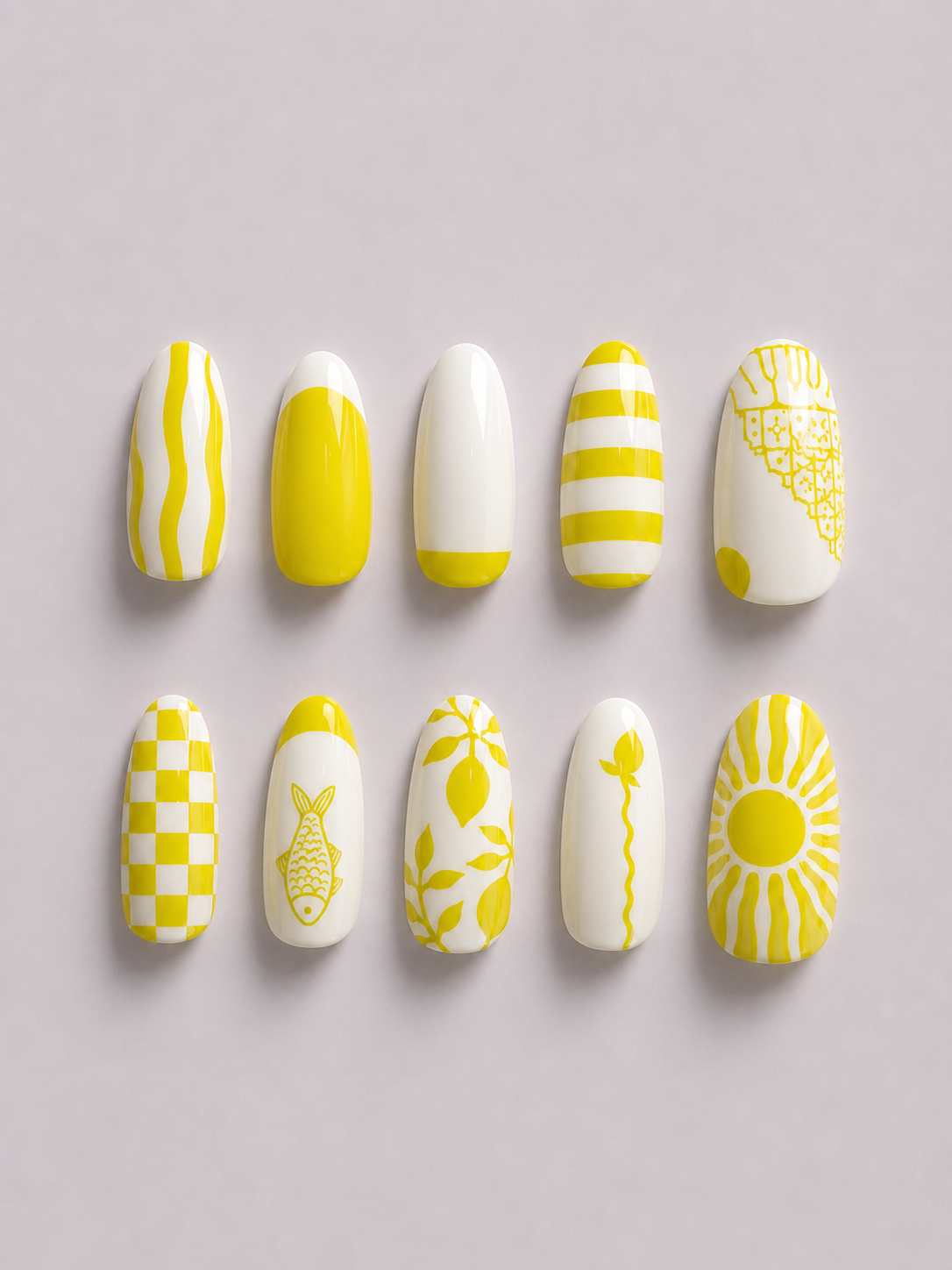 A close-up of a hand with yellow and white nail art designs, emerging from a green sleeve against a solid light gray background.